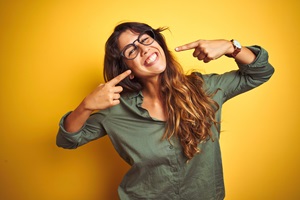 woman smiling wearing glasses